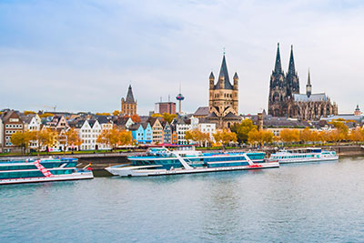 Cruise ships in port in Cologne in front of castle